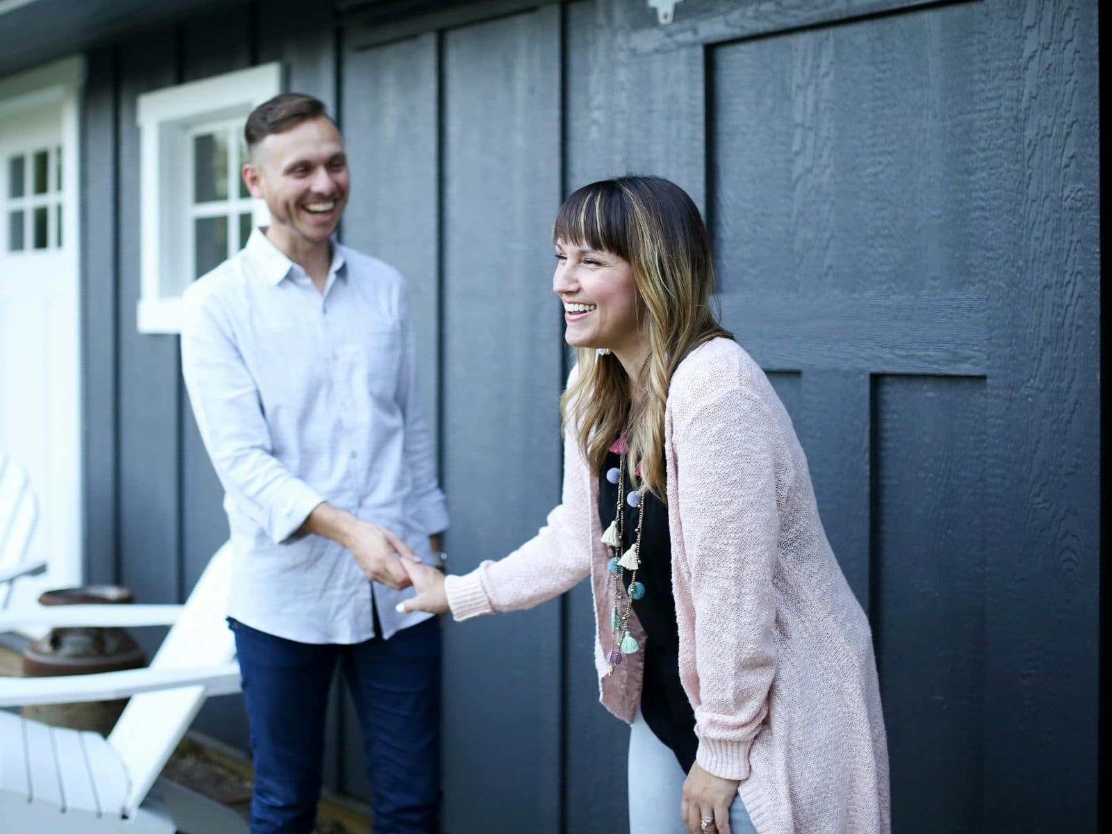 Smiling couple at the front door of their home